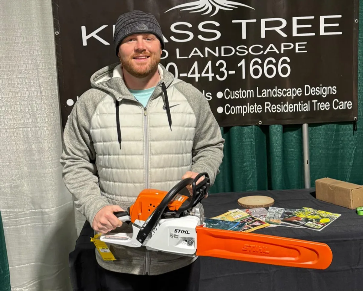 Klass Tree and Landscape crew with a Stihl chainsaw at the trade show