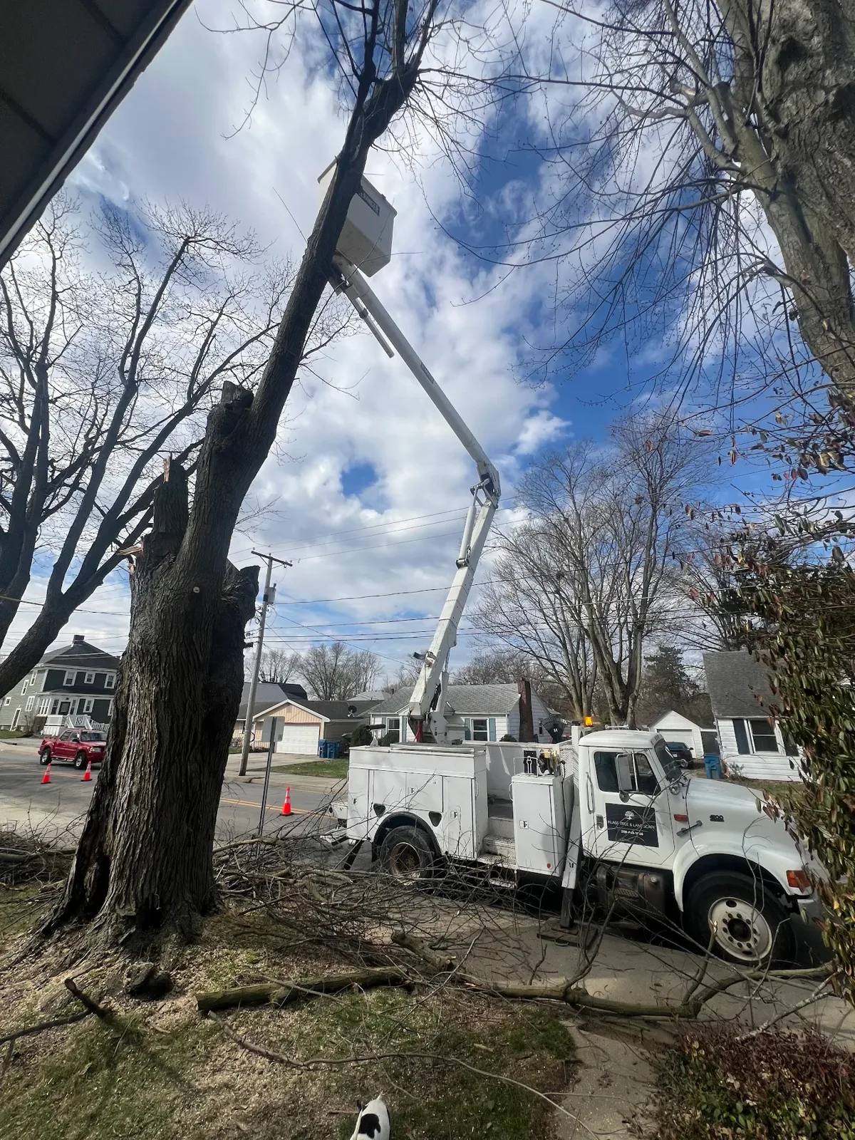 Klass bucket truck positioned on a residential street during a tree removal job in Fort Wayne